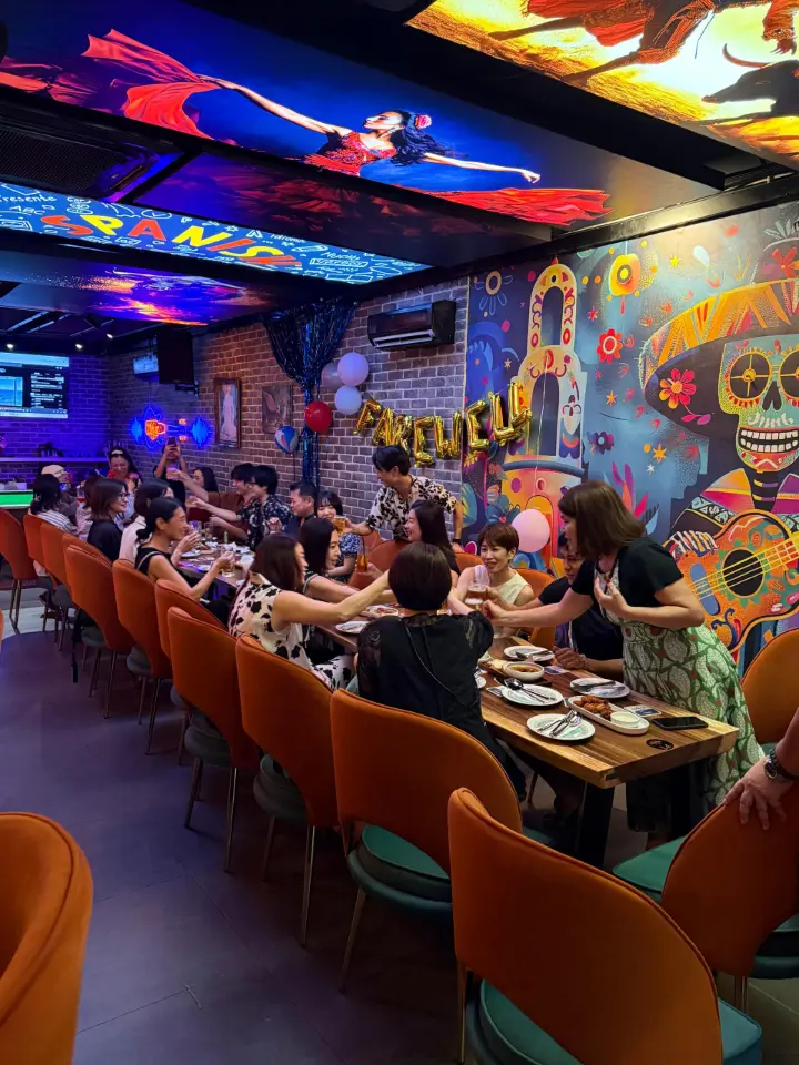 Dining room with colourful neon accents and diners